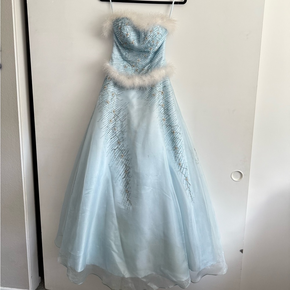 Elegant Blue Beaded Gown with Fur Trim